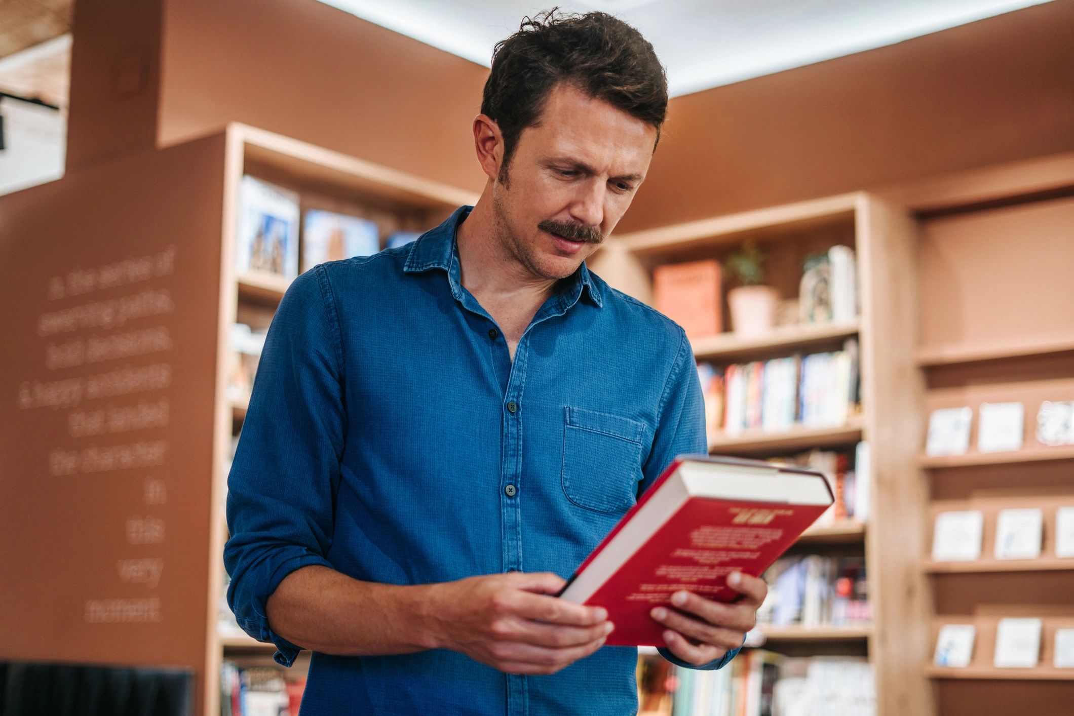 Man browsing books in a bookstore
